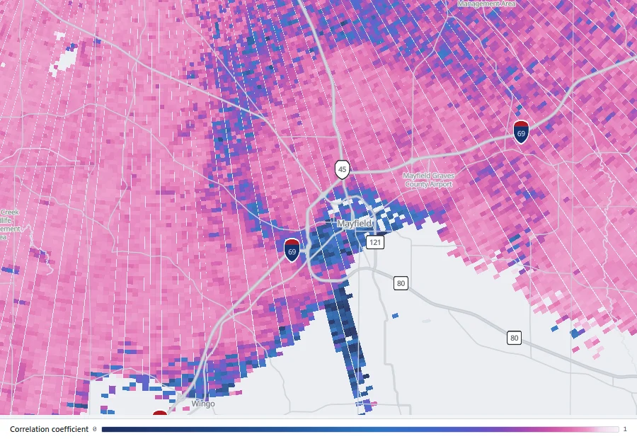 Correlation coefficient showing a dark low-value area over Mayfield, Kentucky, against uniformly high values in the surrounding rain.