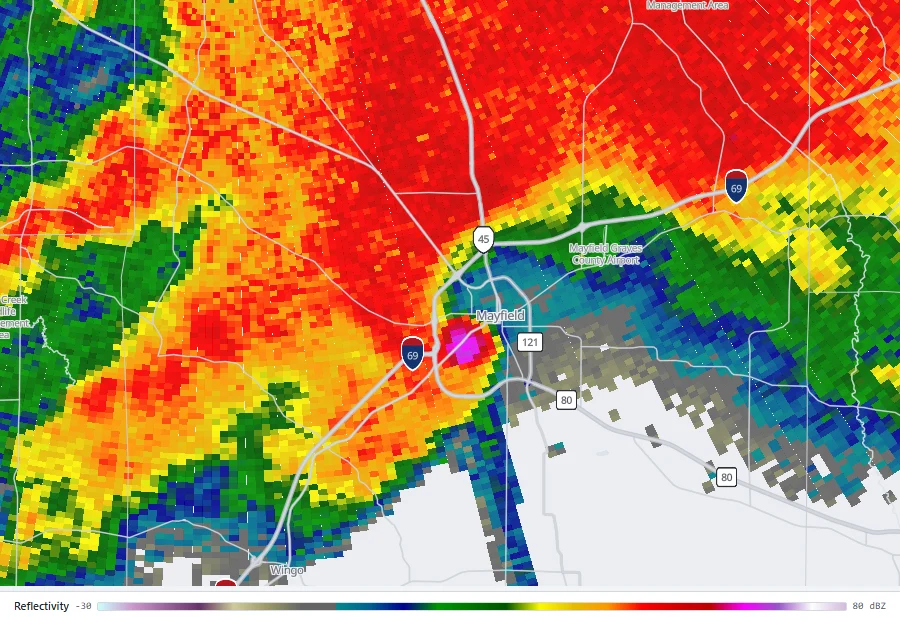 Reflectivity from radar KPAH showing a supercell over Mayfield, Kentucky, with a small magenta core of extreme returned power at the town.