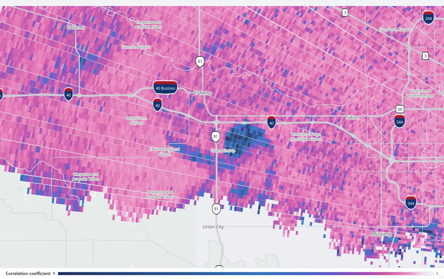 Correlation coefficient over El Reno showing a large dark blue area of collapsed values southeast of the town against uniformly pink rain.