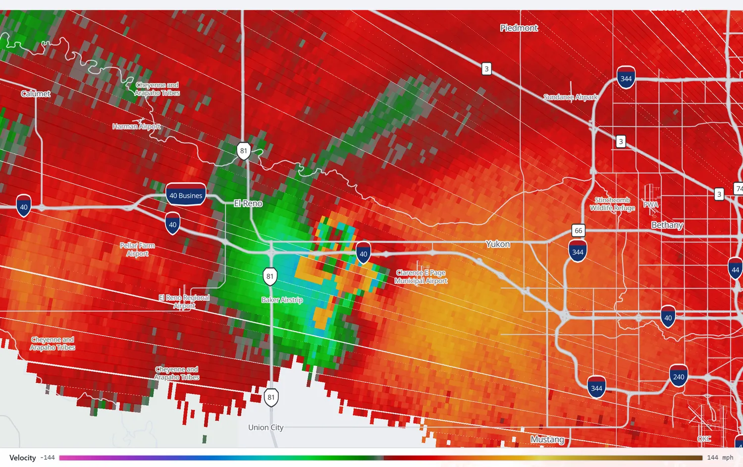 Radar velocity at 6:28 pm showing the tornado's circulation sitting immediately south of Interstate 40 between El Reno and Yukon.