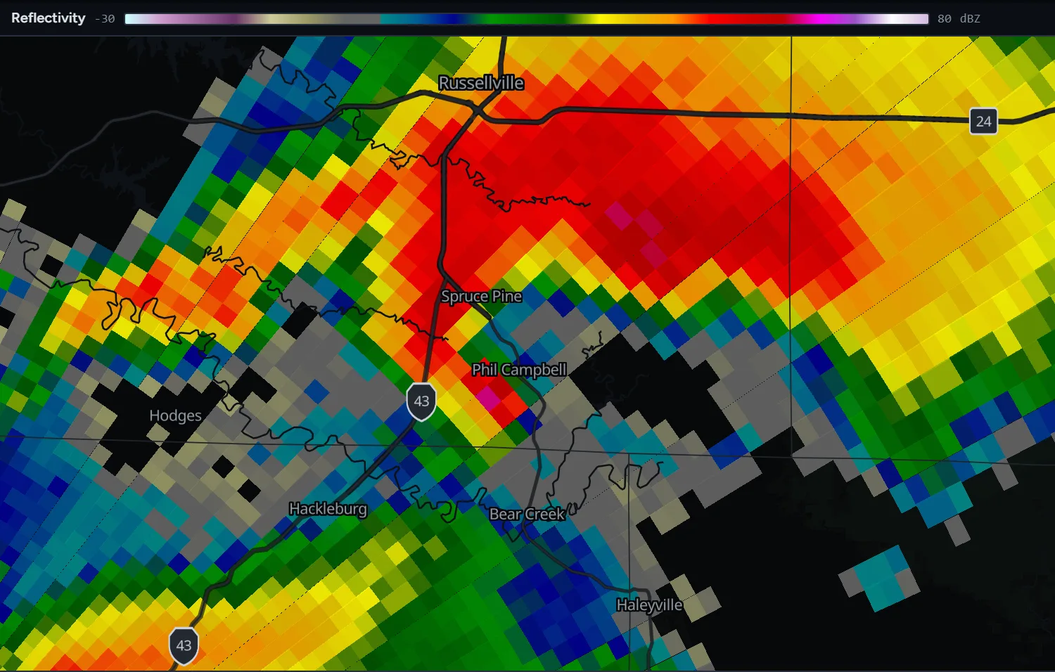 Radar reflectivity from KGWX showing a hook echo ending in a small magenta core just southwest of Phil Campbell, Alabama.