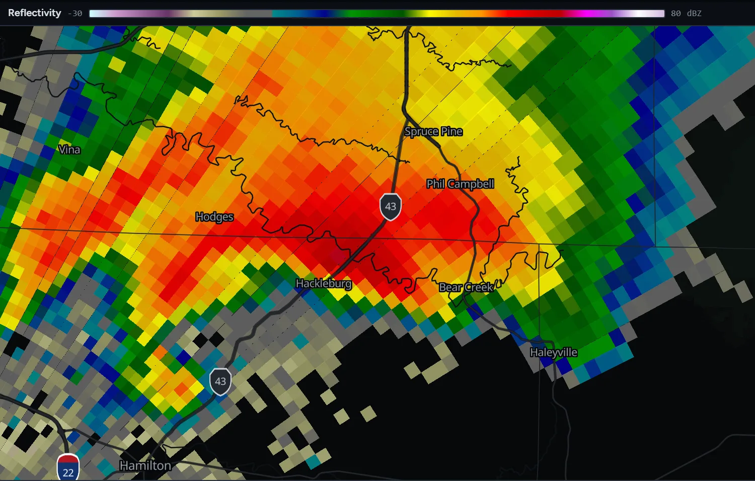 Radar reflectivity from KGWX showing a supercell over Marion and Franklin counties, Alabama, with a hook echo wrapping toward Hackleburg from the west and an inflow notch over the town.