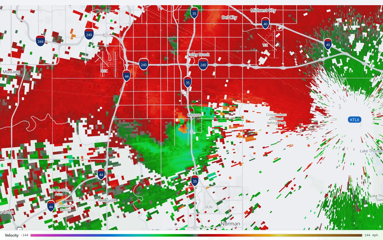 Radar velocity showing an intense couplet of opposing motion over Moore.