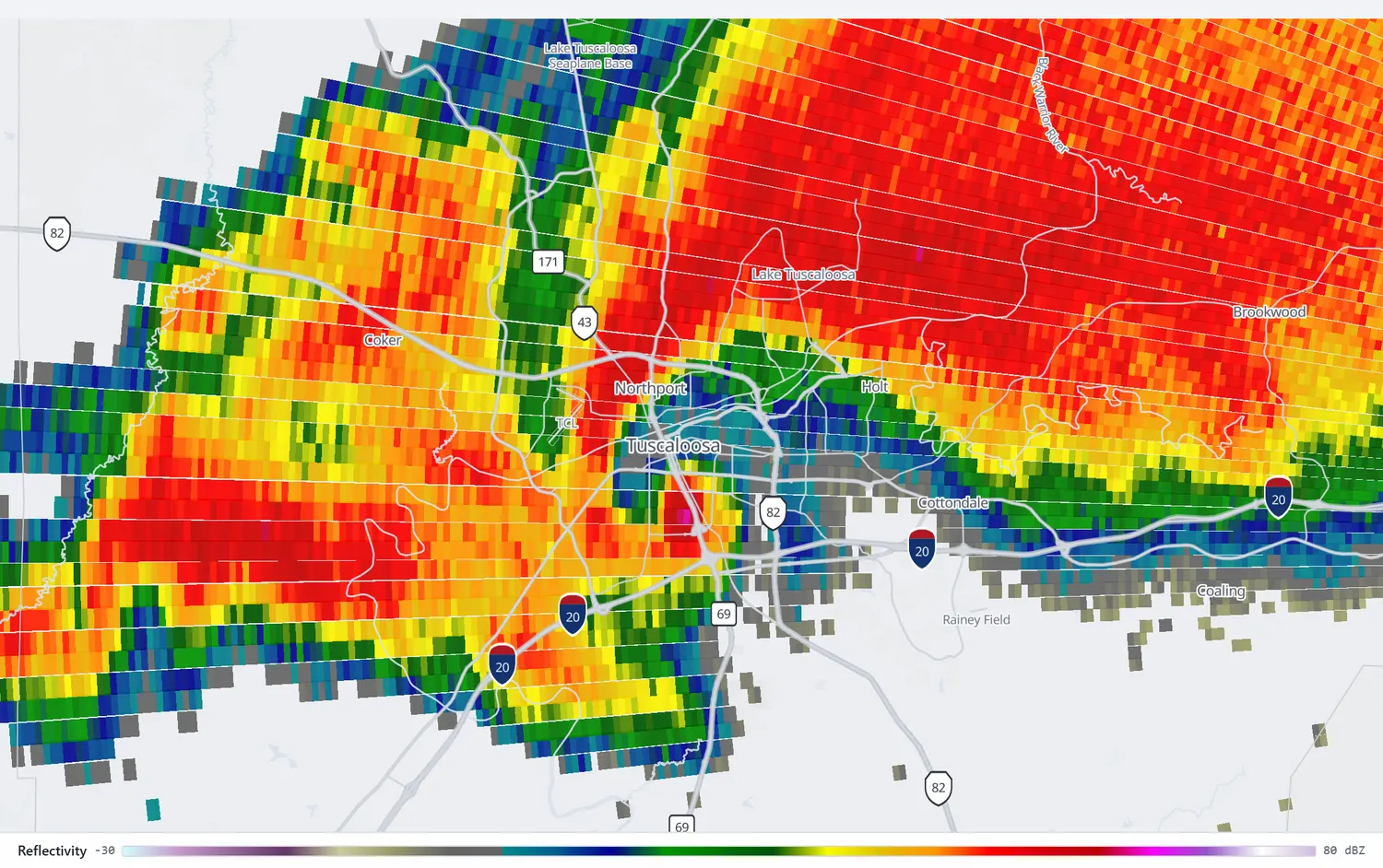 Radar reflectivity showing a pronounced hook echo over Tuscaloosa with a bright core at its tip.